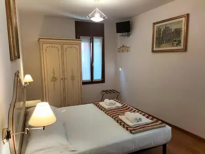 Letto o letti in una camera di RIALTO EXPERIENCE