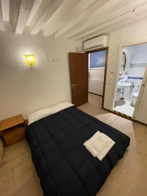 Letto o letti in una camera di Dimora Blu Suite