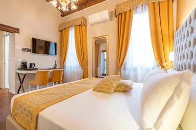 Letto o letti in una camera di Residenza La Duchessa Deluxe Rooms