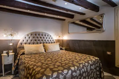 Letto o letti in una camera di Hotel Ca' Marinella