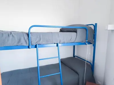 Letto o letti a castello in una camera di Apollo Fronte Mare