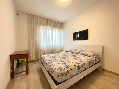 Letto o letti in una camera di Olimpo - Carraro Immobiliare - Family Apartments