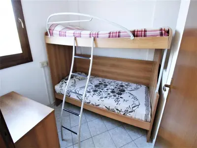 Letto o letti in una camera di Holiday Home in Rosolina Mare near Beach