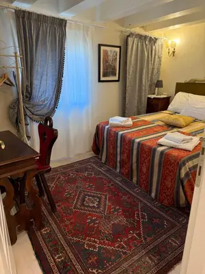Letto o letti in una camera di Cà del Traghetto