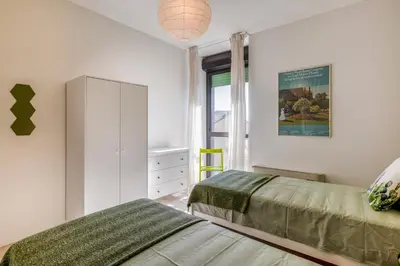 Letto o letti in una camera di GuestHost - Family & Friends Rooms with shared bathroom