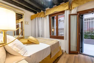 Letto o letti in una camera di Laguna D'oro Luxury Apartments