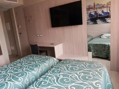 Letto o letti in una camera di Hotel Altieri