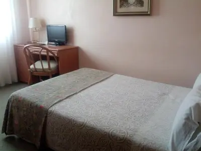 Letto o letti in una camera di Hotel Villa Tiziana