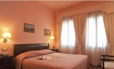 Letto o letti in una camera di Villa Crispi