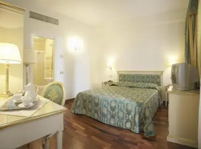 Letto o letti in una camera di Villa Crispi
