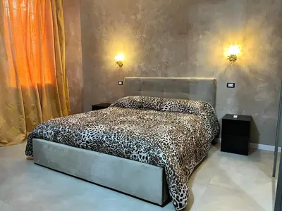 Letto o letti in una camera di Residence Giove