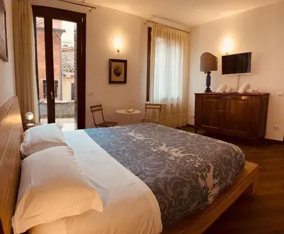 Letto o letti in una camera di Grimaldi Apartments Cannaregio