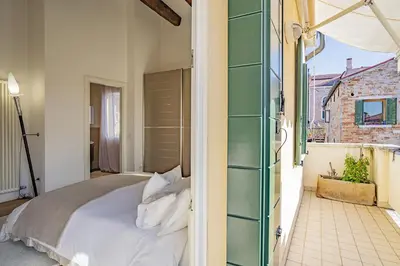 Letto o letti in una camera di Colleoni Apartment with 2 Superb Terraces