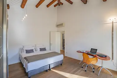 Letto o letti in una camera di Colleoni Apartment with 2 Superb Terraces