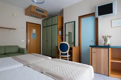 Letto o letti in una camera di Hotel Monaco & Quisisana