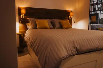 Letto o letti in una camera di BELLINI LIVING APARTMENTS
