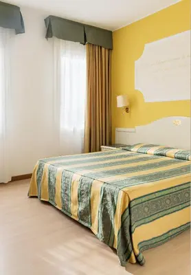 Letto o letti in una camera di Hotel Ca' Tron