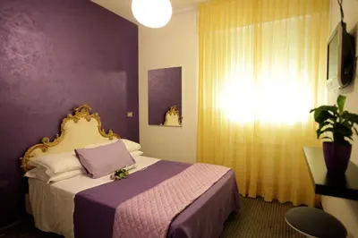 Letto o letti in una camera di Art Hotel
