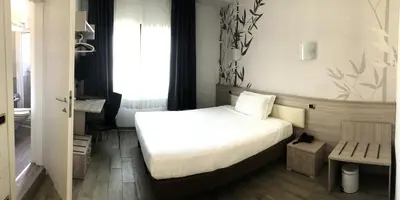 Letto o letti in una camera di Hotel Nuova Mestre