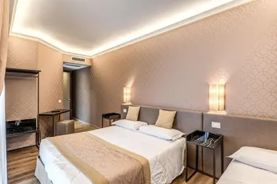 Letto o letti in una camera di Hotel Belle Arti