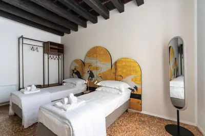 Letto o letti in una camera di Palazzo Miracoli Apartments
