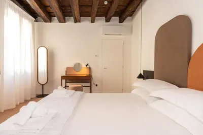 Letto o letti in una camera di Palazzo Miracoli Apartments