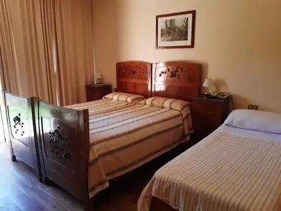 Letto o letti in una camera di Relais Leon d'Oro
