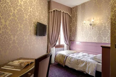 Letto o letti in una camera di Domus Cavanis