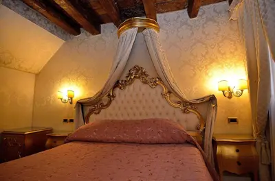 Letto o letti in una camera di Hotel Noemi
