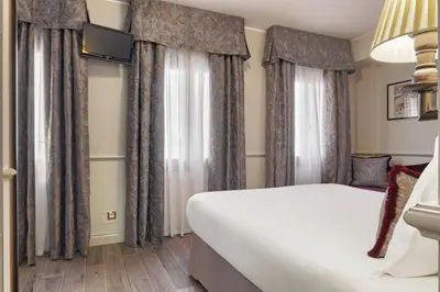 Letto o letti in una camera di Hotel Nuovo Teson