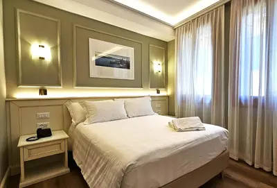 Letto o letti in una camera di Hotel Guerrini