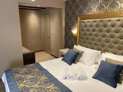 Letto o letti in una camera di Cà Dell'Arte Palace