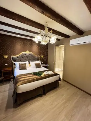 Letto o letti in una camera di Cà Dell'Arte Palace