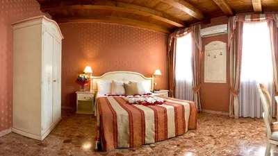 Letto o letti in una camera di Hotel Conterie
