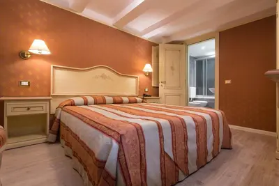 Letto o letti in una camera di Hotel Conterie