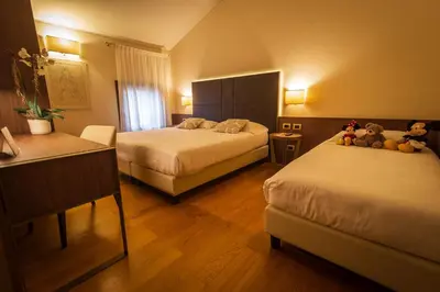 Letto o letti in una camera di Hotel Alla Torre