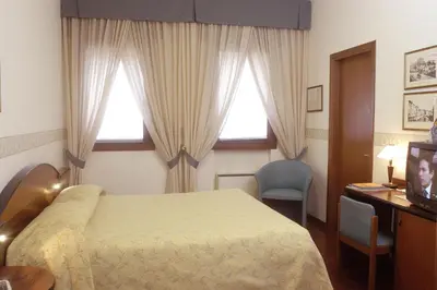 Letto o letti in una camera di Hotel Sagittario