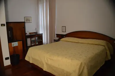 Letto o letti in una camera di Hotel Sagittario