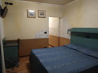 Letto o letti in una camera di Atlantide Hotel