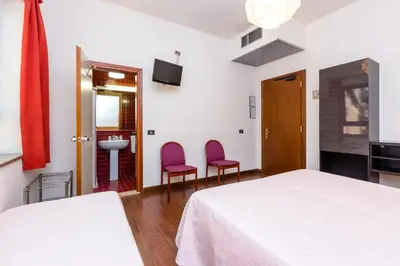 Letto o letti in una camera di Hotel Adria