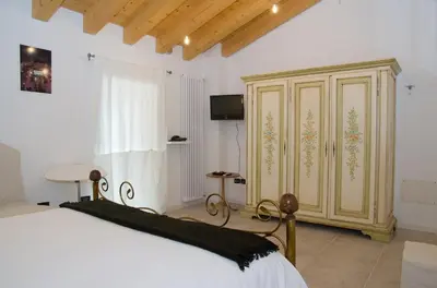 Letto o letti in una camera di B&B Marostica
