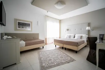 Letto o letti in una camera di Hotel Le Soleil