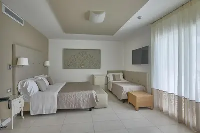 Letto o letti in una camera di Hotel Le Soleil