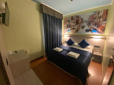 Letto o letti in una camera di Hotel Ducale
