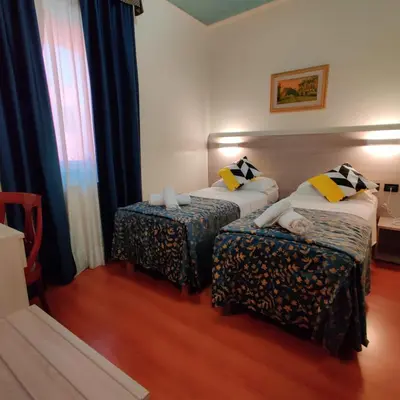 Letto o letti in una camera di Hotel Ducale