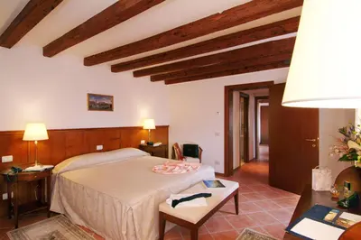 Letto o letti in una camera di Residence Corte Grimani