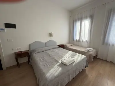 Letto o letti in una camera di Hotel Cristallo