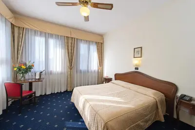 Letto o letti in una camera di Hotel Cristallo