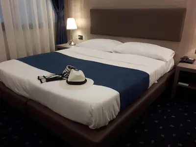 Letto o letti in una camera di Hotel Roberta