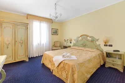 Letto o letti in una camera di Hotel Malibran